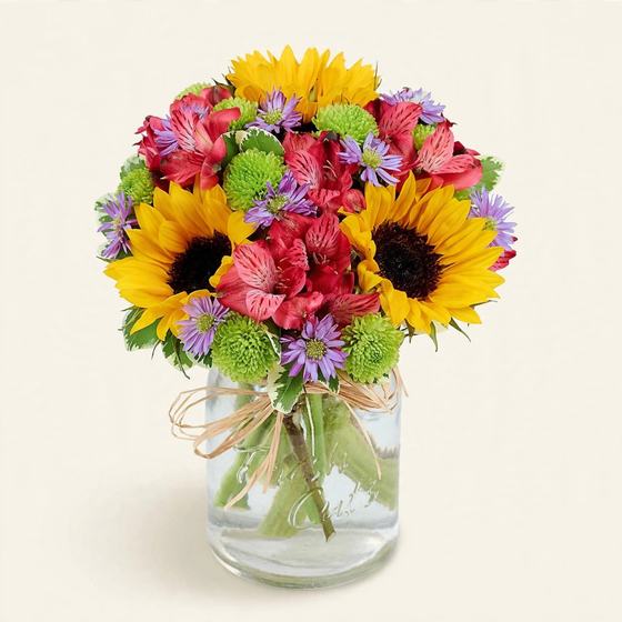 Autumn Sunshine Bouquet with sunflowers, red alstroemeria and purple daisies on a cream background