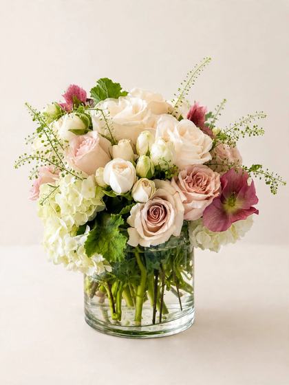 Blush Grace Bouquet with blush and white roses and white hydrangea on a cream background