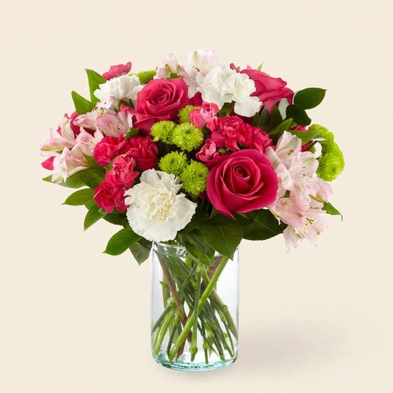 Crimson and White Bouquet with red roses, white carnations and green mums on a cream background