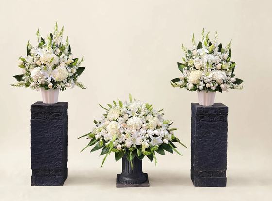 Eternal Peace Funeral Set with two white pedestal sprays and a matching white casket spray