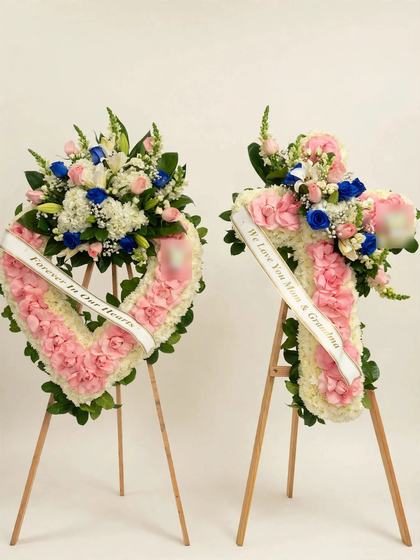 Forever in Our Hearts Funeral Set with a pink and white heart wreath and a matching pink and white cross with satin ribbons