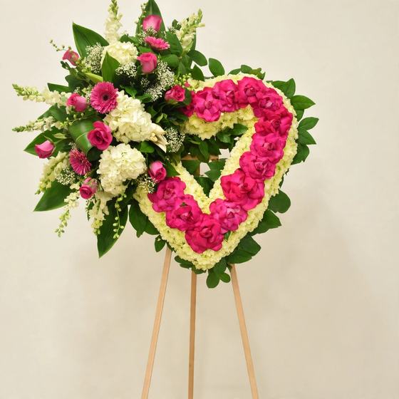 Fuchsia Devotion Heart Wreath of fuchsia roses and white hydrangea on a cream background
