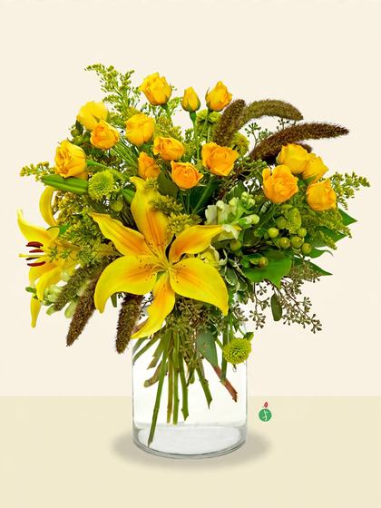 Yellow spray roses, yellow lilies, green mums and foliage in a cylindrical glass vase