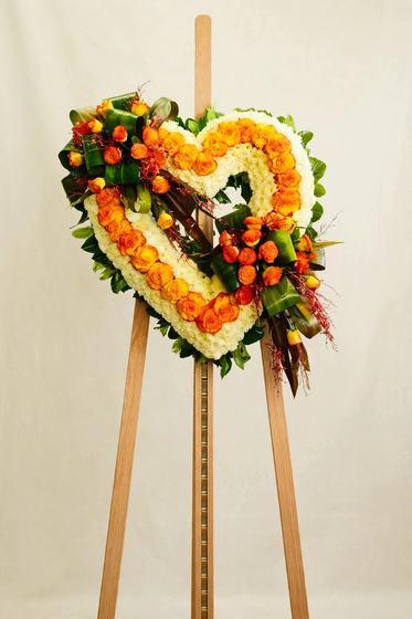 Golden Marigold Heart Wreath of orange marigolds on a cream background