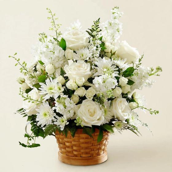 Heavenly White Basket with white roses, mums and daisies on a cream background