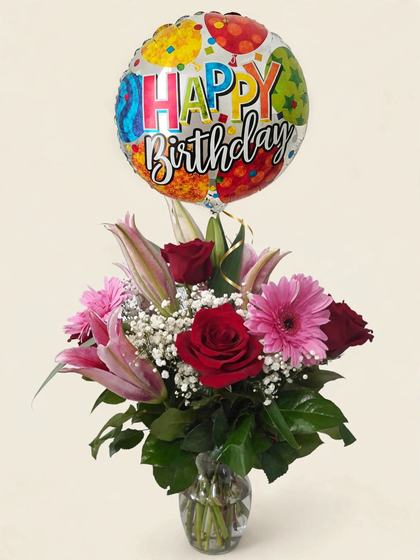 Red roses, pink lilies and gerberas with baby's breath and a Happy Birthday balloon
