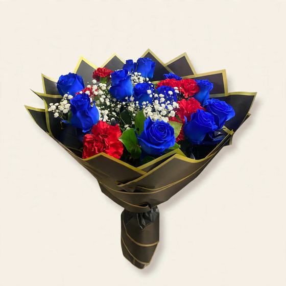 Blue and red roses with baby's breath in black and gold wrap on a cream background
