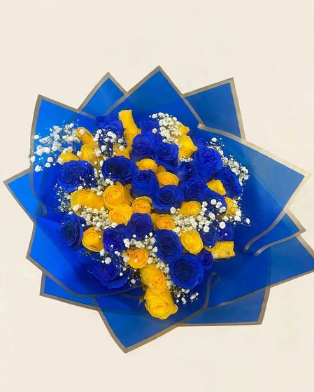 Fifty blue and yellow roses with baby’s breath in blue wrap with silver trim