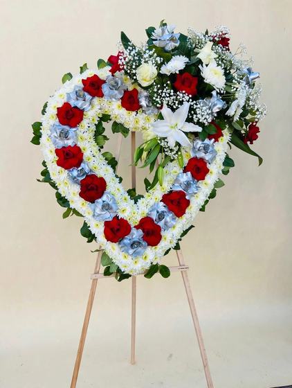 Ruby and Silver Heart Wreath with red roses, silver-blue roses and white mums on a cream background