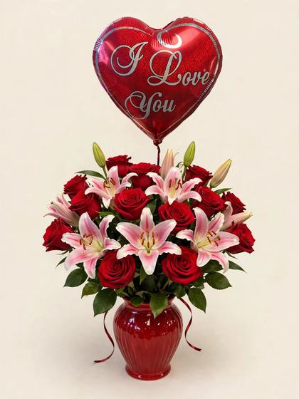 Red roses and pink and white stargazer lilies in a red vase with an I Love You heart balloon