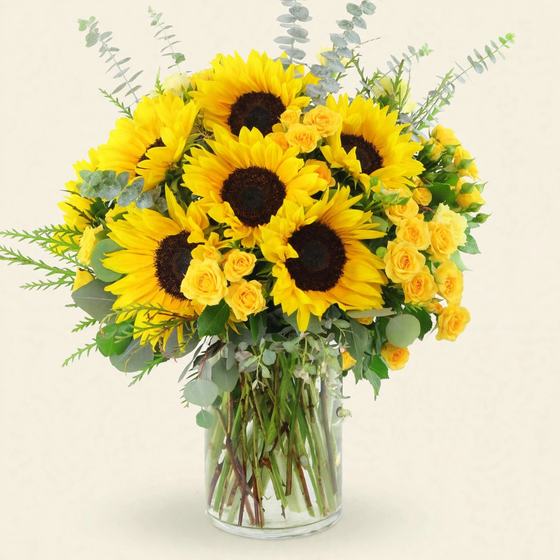 Sunflower Radiance Bouquet with sunflowers and yellow spray roses on a cream background
