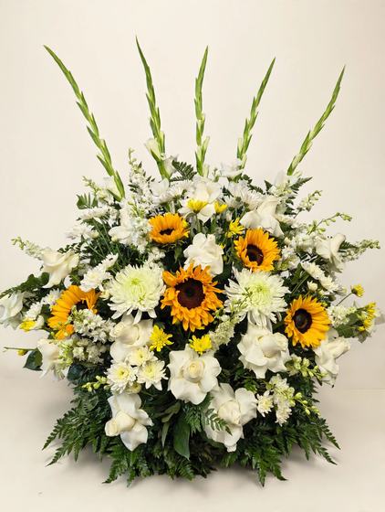 Sunshine and Peace Tribute with sunflowers, white roses, white chrysanthemums and white gladiolas on a cream background